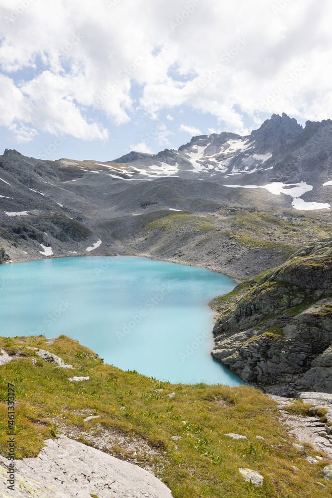 Amazing hiking day in one of the most beautiful area in Switzerland called Pizol in the canton of Saint Gallen. A wonderful view at the alpine lake called Wildsee with a tent by the lake. Epic view.