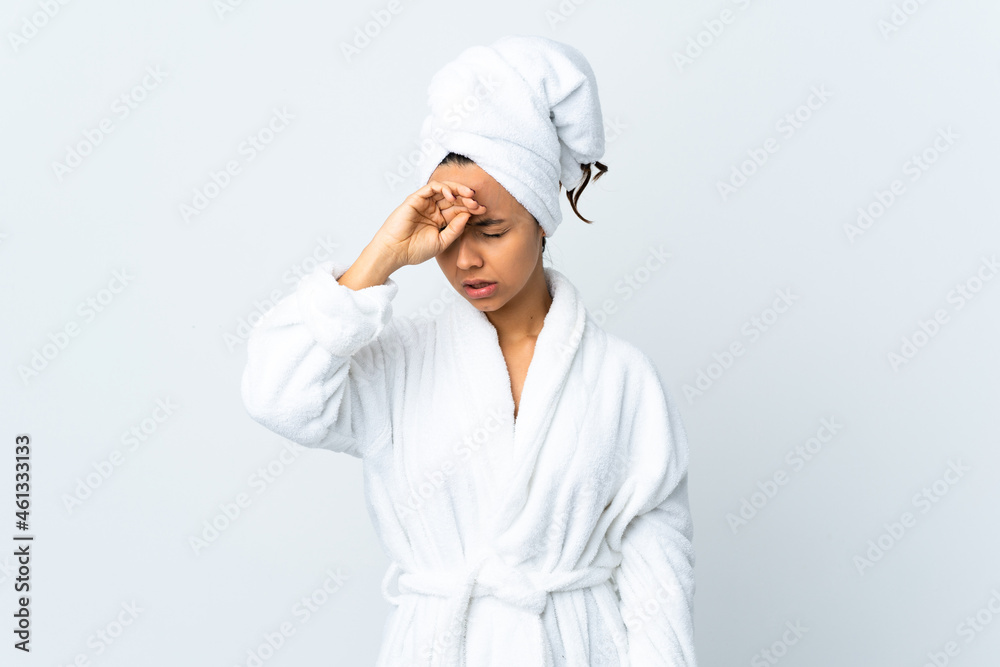 Young woman in bathrobe over isolated white background with tired and sick expression Young woman in bathrobe over isolated white background with tired and sick expression