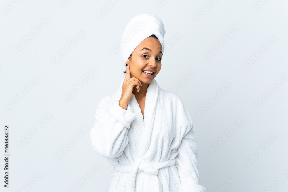 Young woman in bathrobe over isolated white background laughing Young woman in bathrobe over isolated white background laughing