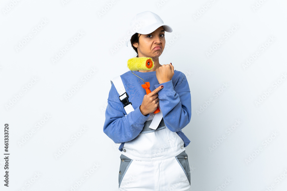 Painter woman over isolated white background making the gesture of being late