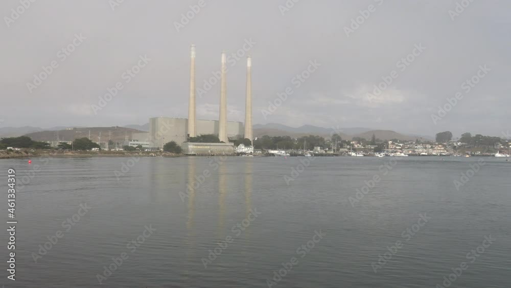 A Pan of Morro Bay California Waterfront from left to Right and Right to Left with the Waterfront and Three Towers in View A Pan of Morro Bay California Waterfront from left to Right and Right to Left with the Waterfront and Three Towers in View