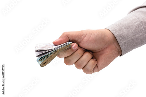 businessman hand offering cash payment, isolated white background, brazilian money.