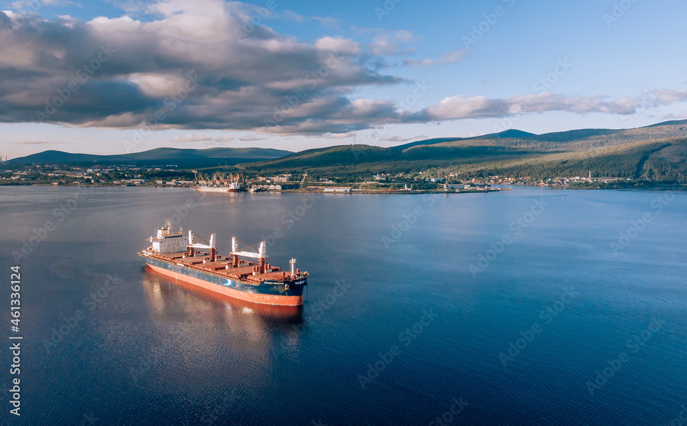 Large cargo ship in the White sea aerial view.