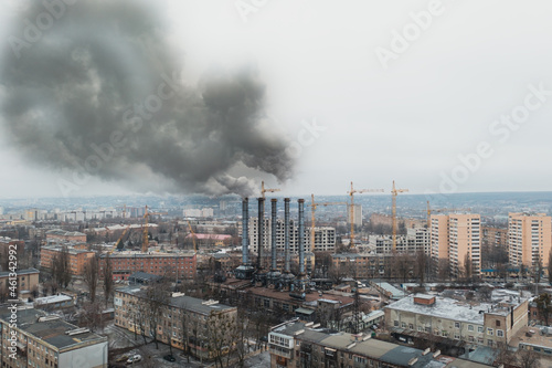 Urban Air Pollution from Smoke Emissions: The Impact of Cities on Global Warming. Black Smoke from the chimneys of the factory in the city. © Andrii Chagovets