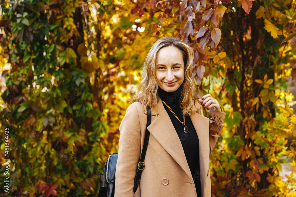 woman wolking in autumn park 