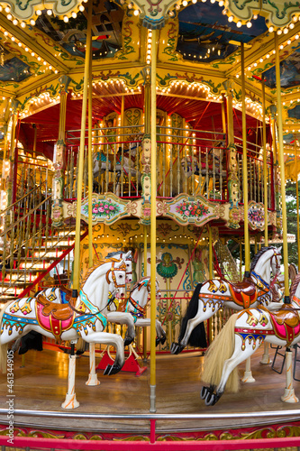 detail of the horses of an old carousel for children