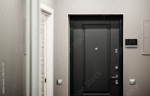 Spacious entrance hall in the apartment with built-in wardrobe and mirrors