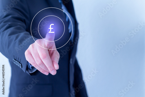 businessman pressing Pound Sterling button
