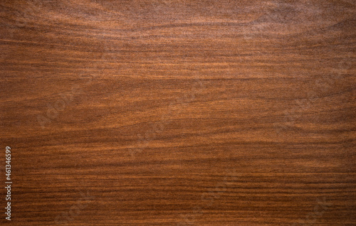 Photo of a vintage mahogany texture in the style of the 30s. Antique furniture wood. Classic wooden veneer.