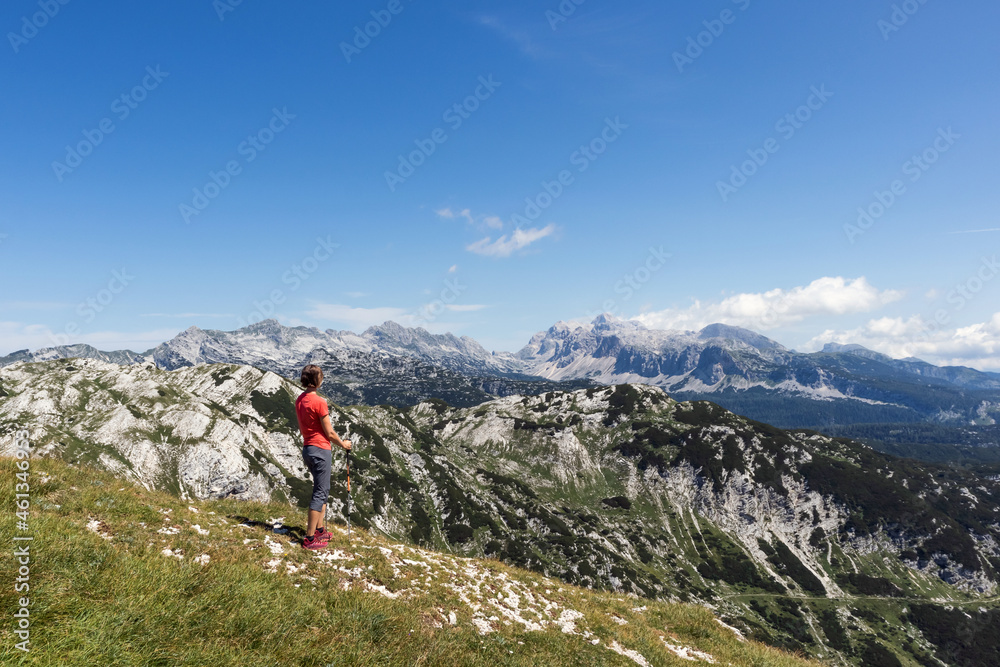 Woman enjoying an amazing view of mountain peaks