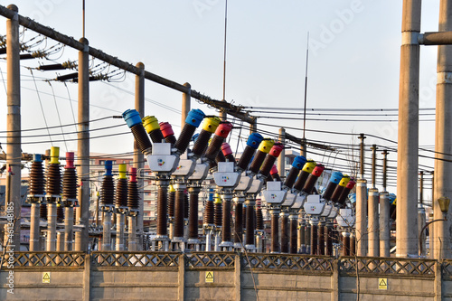 Closeup of isolators and transformers at the electrical substation photo