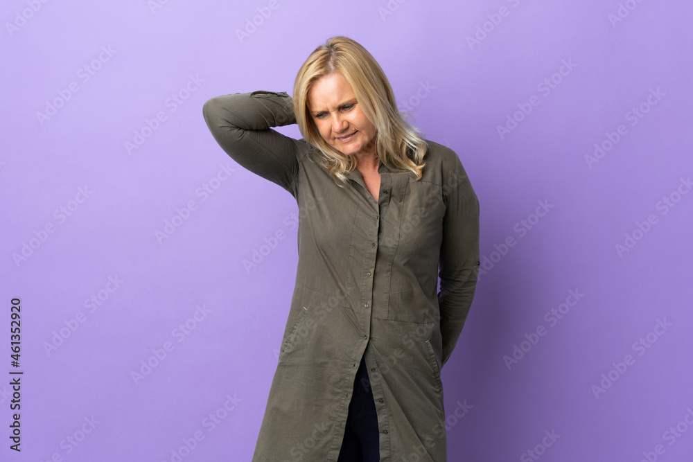 Middle age Lithuanian woman isolated on purple background with neckache Middle age Lithuanian woman isolated on purple background with neckache