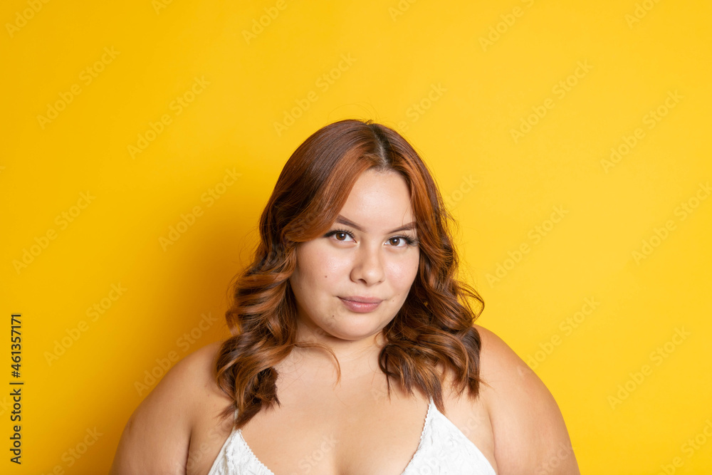 portrait of mixed race redhead plus size model looking at camera portrait of mixed race redhead plus size model looking at camera