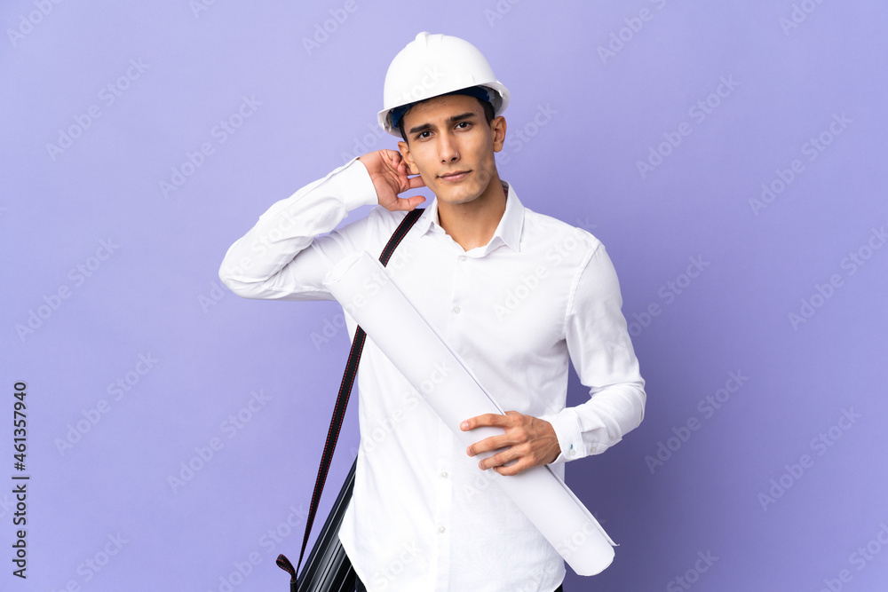 Young architect man isolated on background having doubts Young architect man isolated on background having doubts