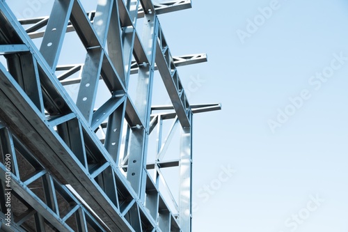 Engineer technician watching team of workers on high steel platform