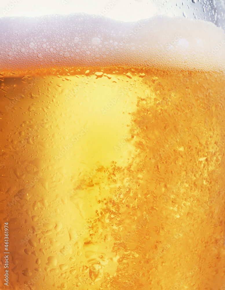 Closeup of beer in glass with condensation Closeup of beer in glass with condensation