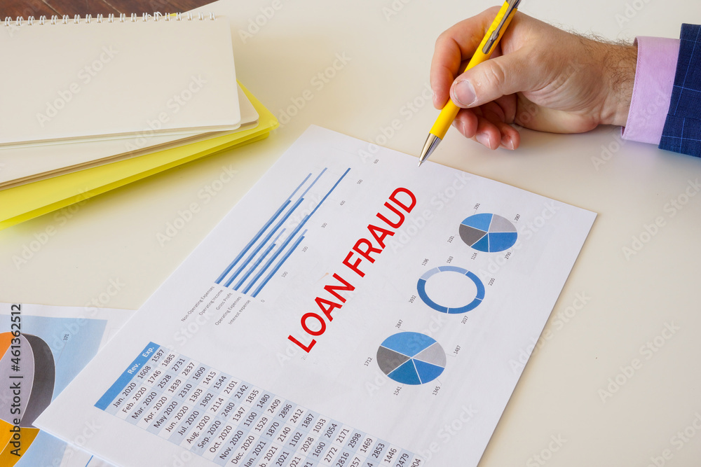 Financial concept meaning LOAN FRAUD with phrase on the piece of paper. Financial concept meaning LOAN FRAUD with phrase on the piece of paper.