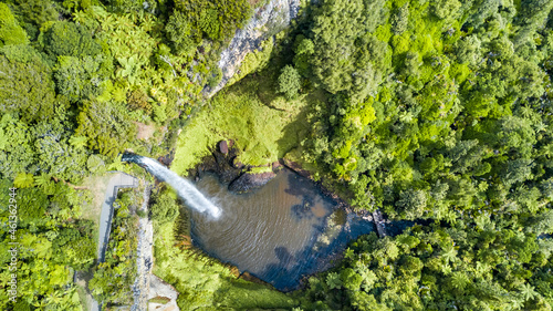 Beautiful waterfall in the middle of native forest. North Island, New Zealand.
