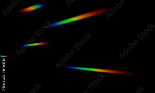 the rainbow light scattered on a black background. the snappy abstract flare for overlay or effect in any creative design.