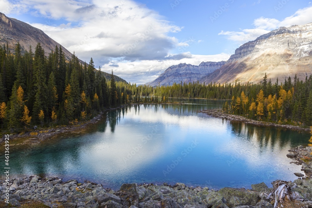 Scenic Aerial View of Beautiful Linda Lake with Clouds and Mountains Reflected in Calm Water.  Autumn Colors Hiking in Yoho National Park, British Columbia, Canadian Rockies