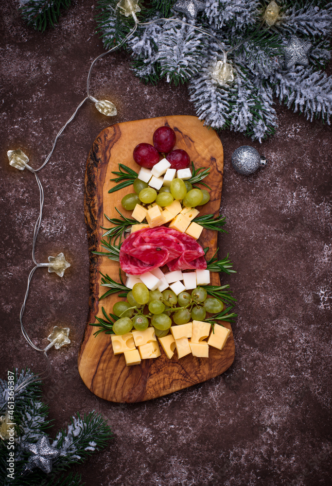Fototapeta premium Appetizers plate in shape of Christmas tree.