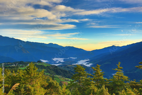 Beautiful landscape of continuously mountains with amazing sky cloud and green trees at dawn  © qaz1235