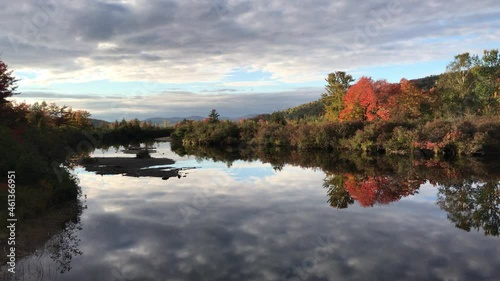 Reflective Autumn Riverway & Distant Mountain Scene