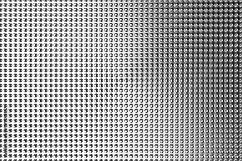 3D illustration of rows of metal bumps. A set of pimples on a monochrome background, pattern. Geometric background