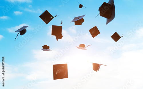 Group of graduation caps thrown in the air Fototapet