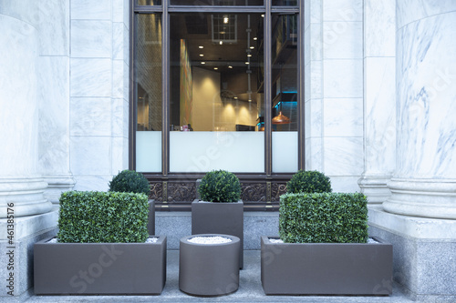 Big gray, metal planters with foliage plants and terrace design photo