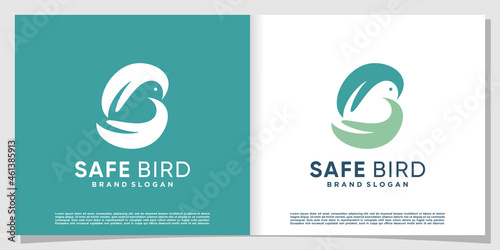 Bird logo abstract with hand holding a bird Premium Vector