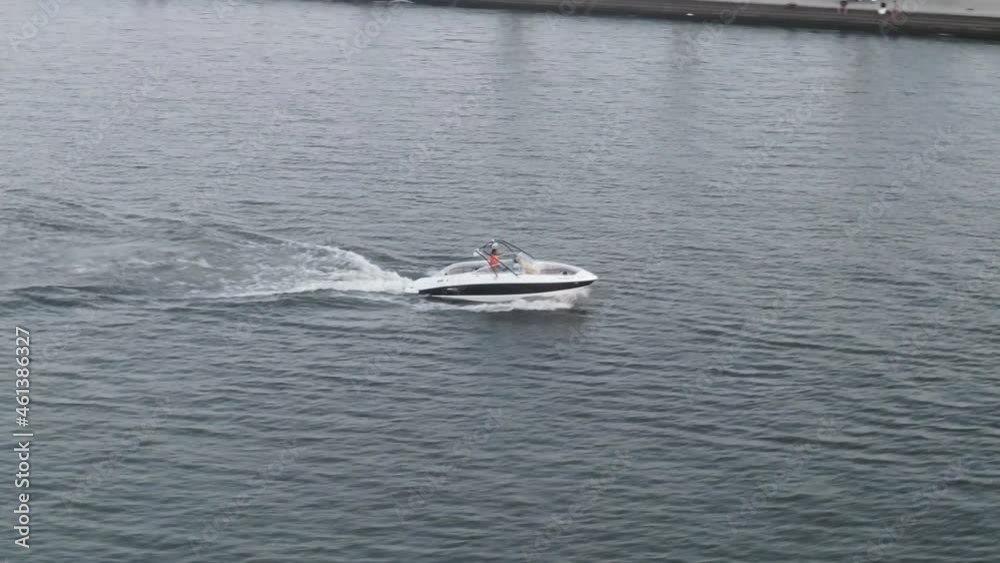 Isolated Power Boat On Speed Sailing Across Lake Pontchartrain In New Orleans, Louisiana USA. Aerial Isolated Power Boat On Speed Sailing Across Lake Pontchartrain In New Orleans, Louisiana USA. Aerial