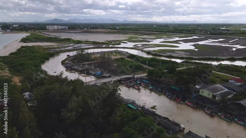 Wallpaper Mural 4K Aerial Drone Footage with Orbital Rotation Over a Small Fishing Village Along the Coast of Thailand. Torontodigital.ca