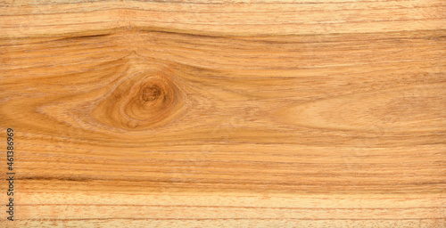 Close-up natural teak (Tectona grandis) wood with gnarl texture background.