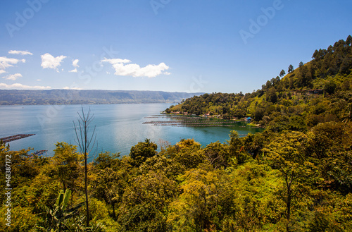 Lake Toba is a large natural lake in North Sumatra, Indonesia, located in the caldera of Mount Supervolcano. View from Parapat. This lake has a length of 100 kilometers, a width of 30 kilometers. 