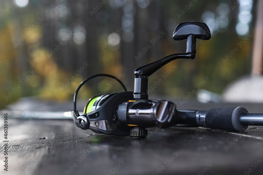 Reel of fishing rod closeup. Fishermans equipment. Reel of fishing rod closeup. Fishermans equipment.