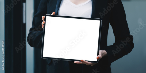 Fototapeta Naklejka Na Ścianę i Meble -  A Woman excited surprise and showing digital tablet white screen. Blank screen for your advertising.