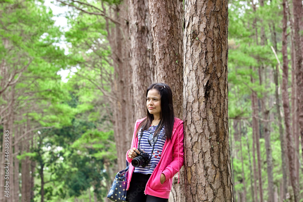 portrait of a woman in the pine forest