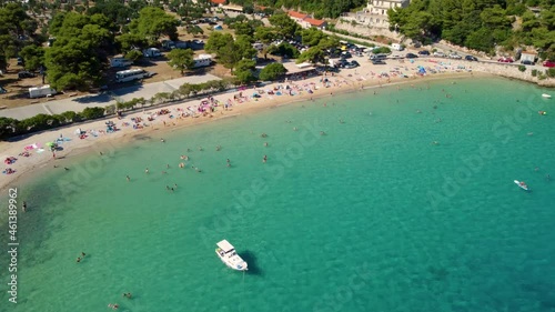 Boats Floating On Clear Water Of Sea With People Relaxing And Swimming At Prapratno Beach In Croatia. - aerial photo