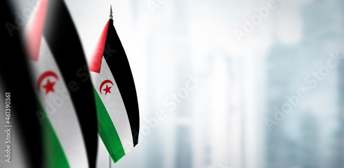Small flags of Sahrawi on a blurry background of the city