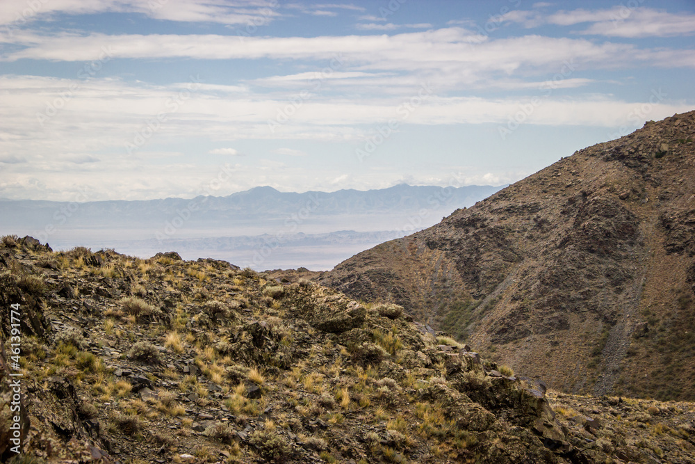 Beautiful Summer scenery: rocky mountains under the blue cloudy sky