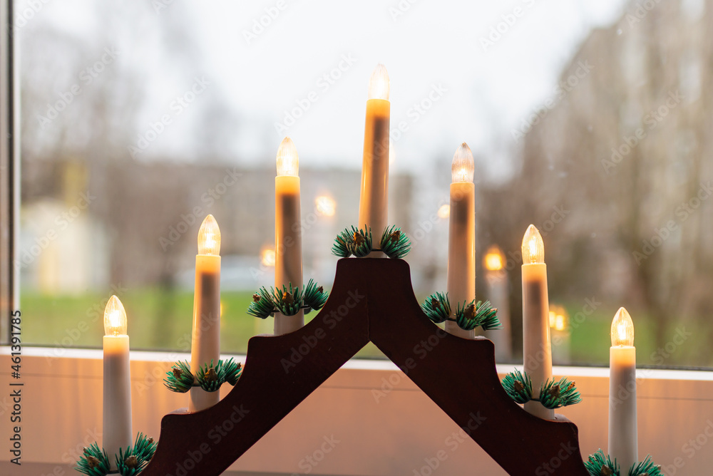 Advent electric candles on window sill.electrical advent candles by the