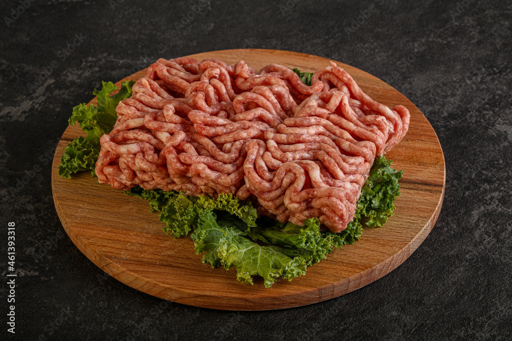 Raw pork minced meat over board Raw pork minced meat over board