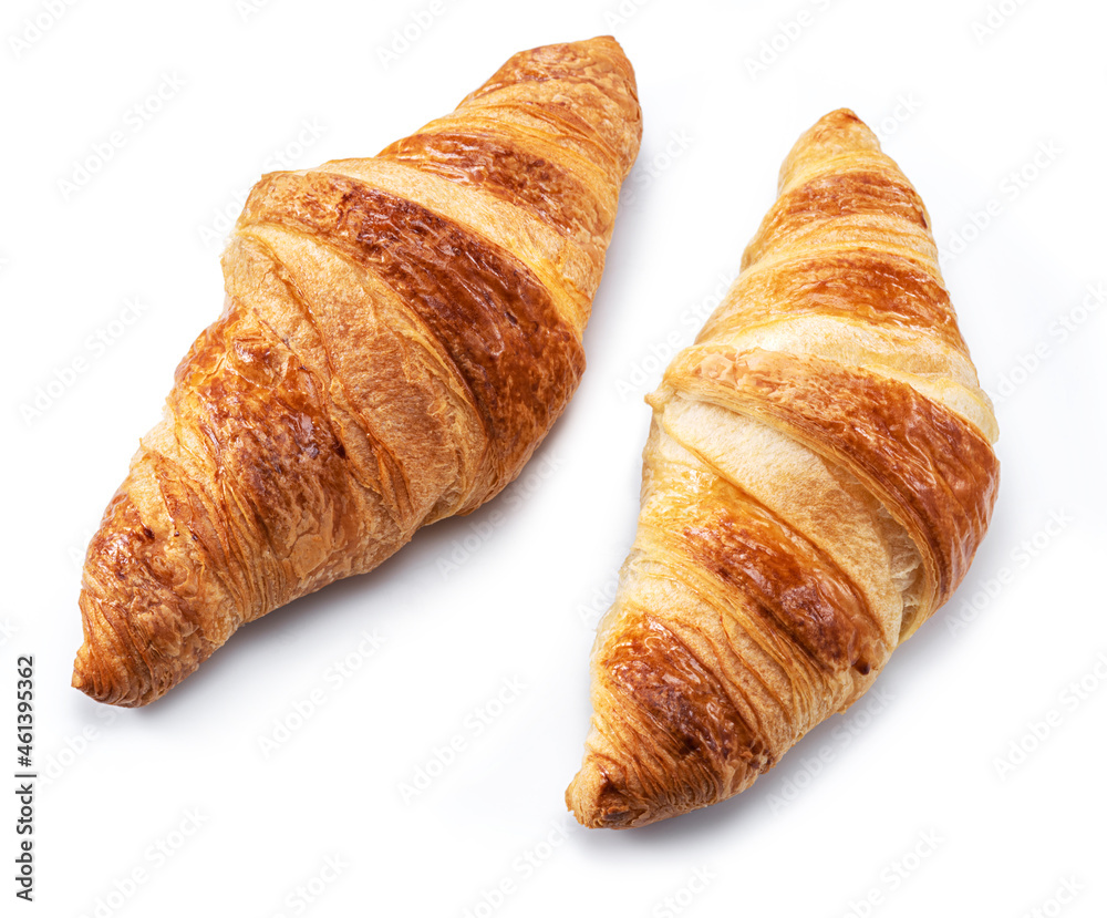 Tasty crusty croissants close-up on a white background. Top view. Tasty crusty croissants close-up on a white background. Top view.