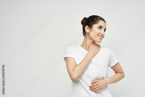 woman holding on to the neck health care isolated background