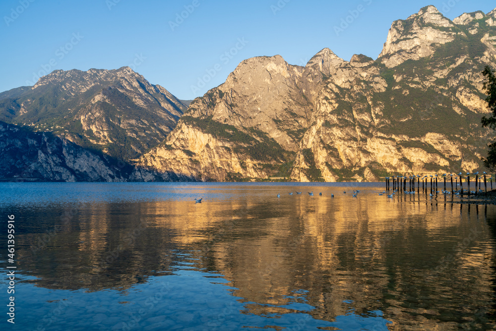 Sunrise at the north side of lake garda, with view of the mountains. From torbole