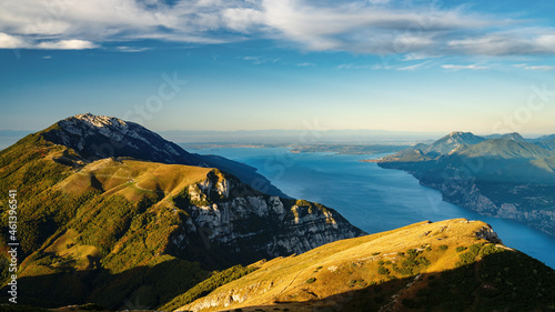 Mountain monte baldo at sunrise with lake garda and sirmione in the background. Early morning