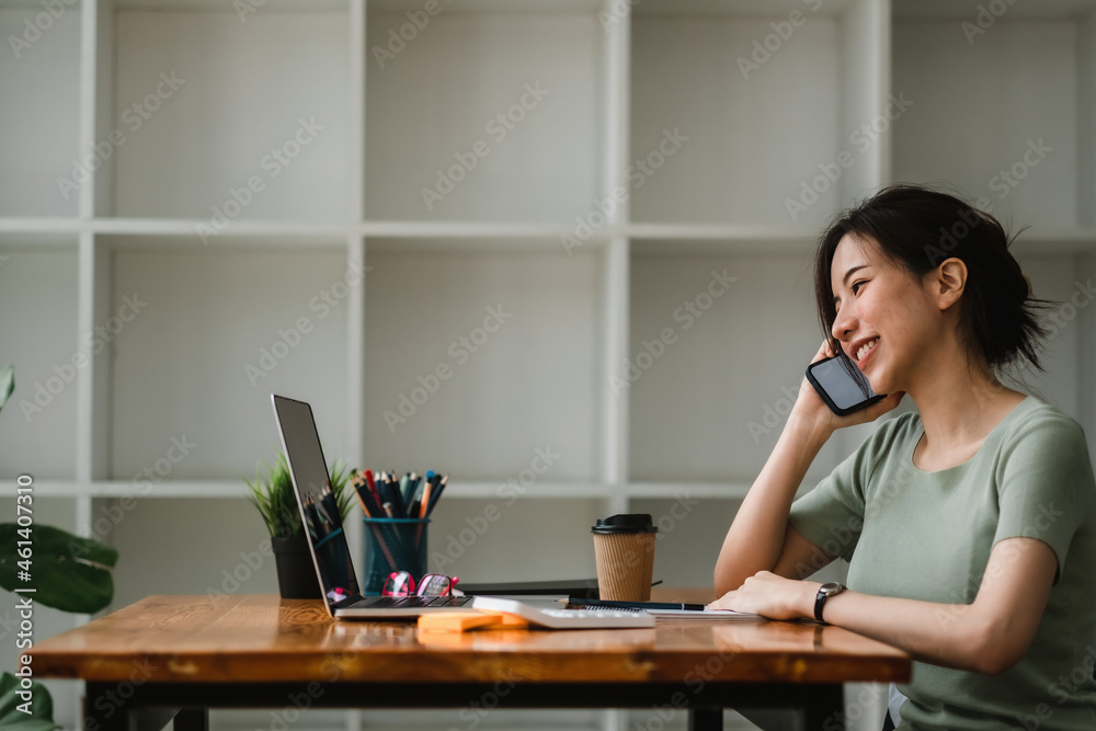 Business woman working for accounting financial and taking notes in notebook during call for consultation at home Business woman working for accounting financial and taking notes in notebook during call for consultation at home