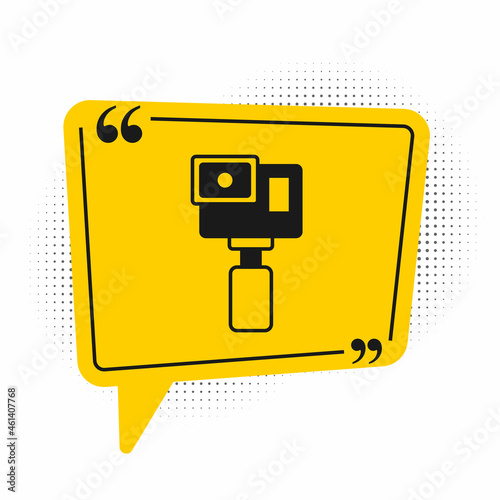 Black Action extreme camera icon isolated on white background. Video camera equipment for filming extreme sports. Yellow speech bubble symbol. Vector