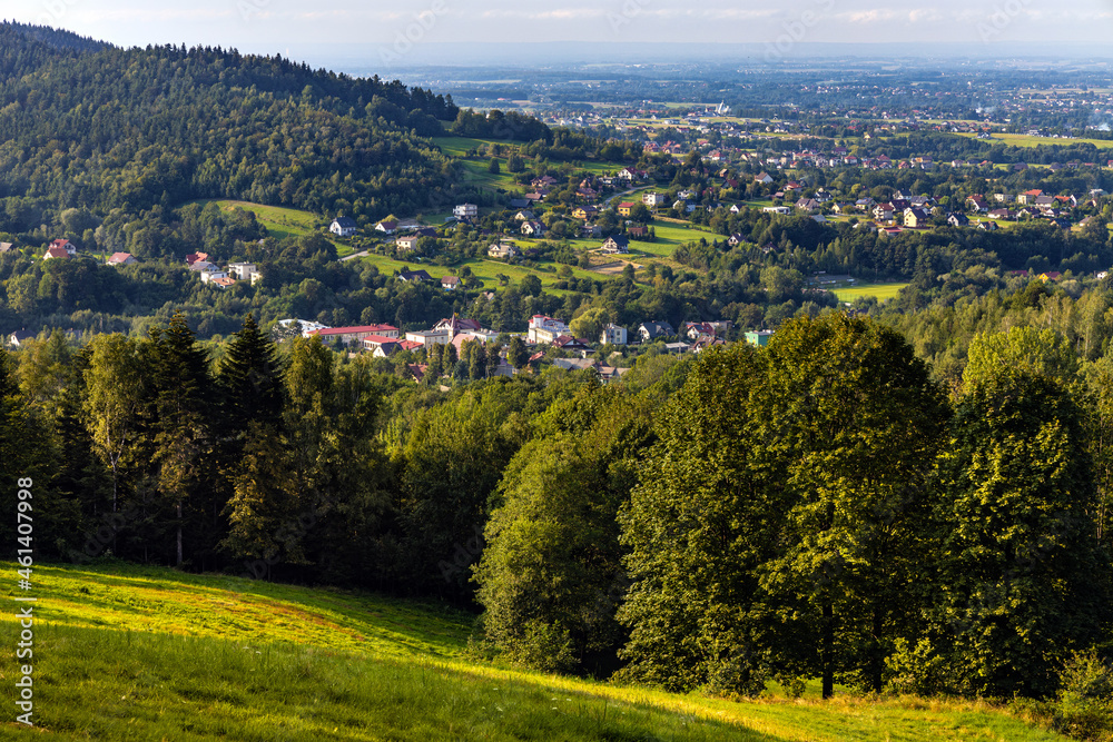 Panoramic view of northern slope of Little Beskids in of Beskidy Mountains with Targanice Village near Andrychow town in Lesser Poland Panoramic view of northern slope of Little Beskids in of Beskidy Mountains with Targanice Village near Andrychow town in Lesser Poland